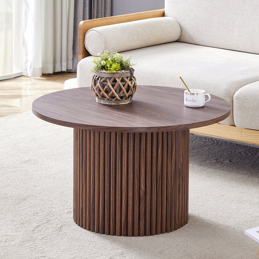 A modern circular coffee table with a diameter of 27.5 inches. MDF material,cylindrical table leg design.Becoming the visual focal point of home decoration.W1151P270614
